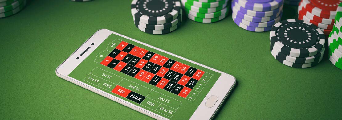 roulette on a mobile phone with casino chips around on the table