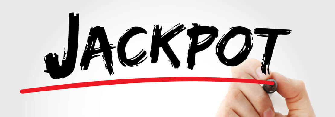 a hand drawing a red underline on the word Jackpot