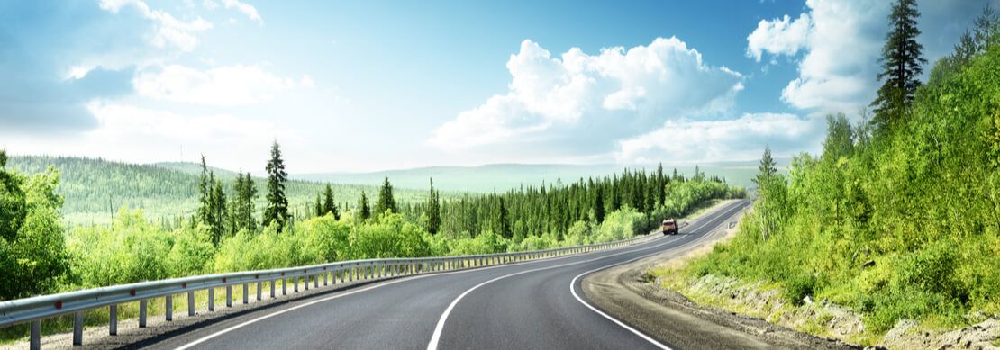 view down a road in a mountain forest