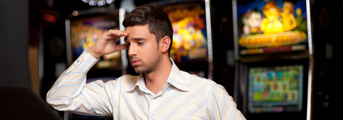 a player in a land-based casino looking very confused