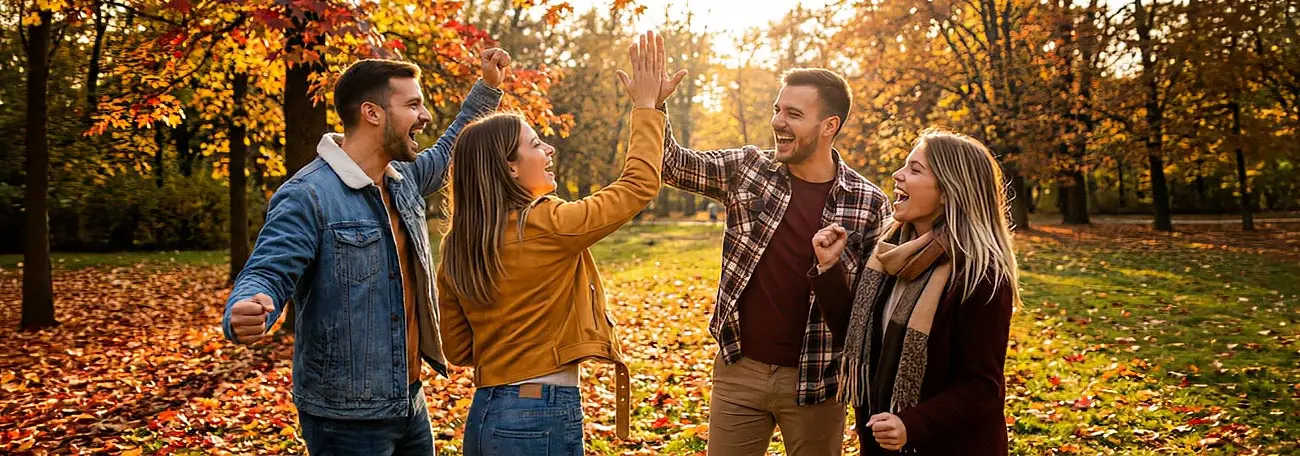 five happy, smiling, and laughing young people having a great time on vacation together