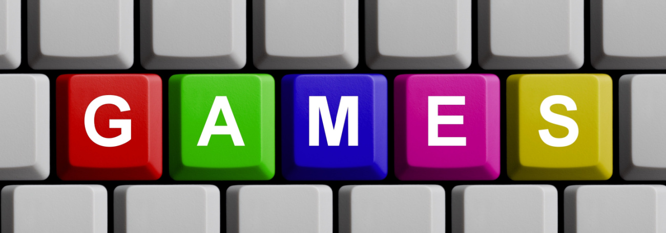 a keyboard with the word games in attractive colors. L to R red, green, blue, pink, yellow