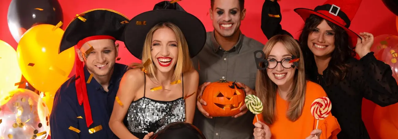 a small group of young adults having a great time at a Halloween party.