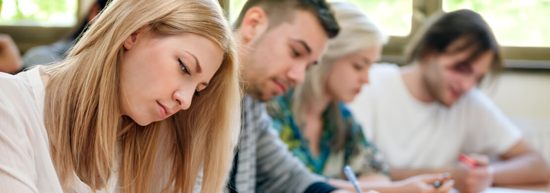 a class of people taking a quiz