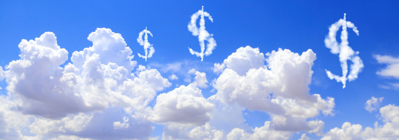 An image of white puffy clouds and dollar signs made up of clouds against a bright blue sky