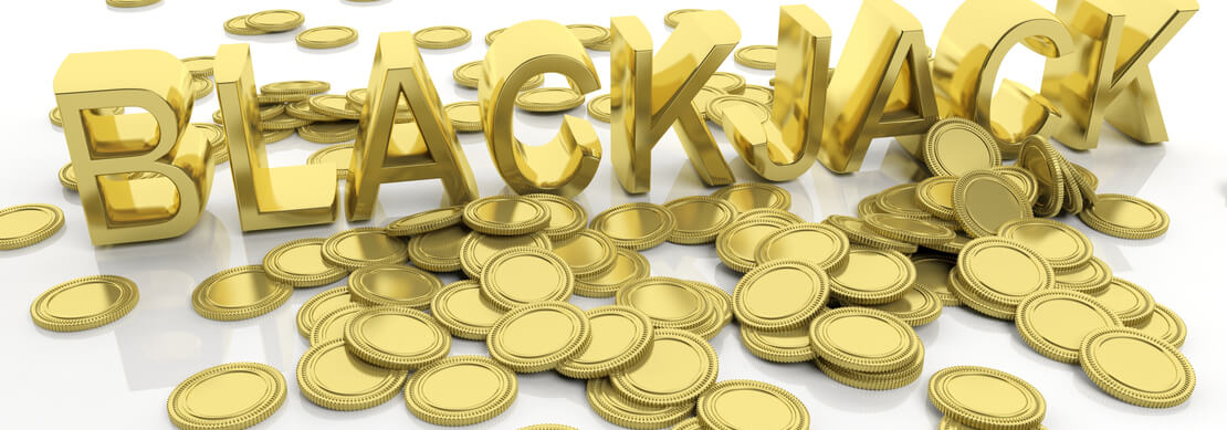 a large number of gold coins strewn about a white table with BLACKJACK in bold, gold letters
