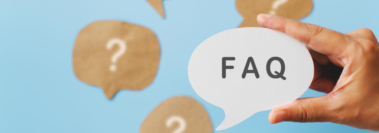 a man holding a cloud with FAQ on the cloud and question marks surrounding the cloud