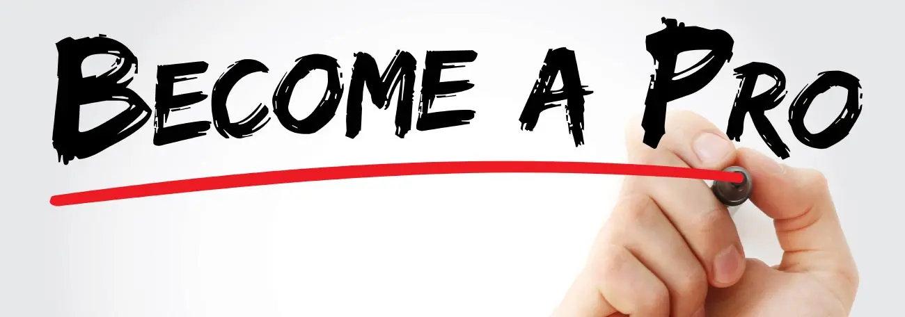 the words "become a Pro" in black on a whiteboard with a red line drawn beneath it